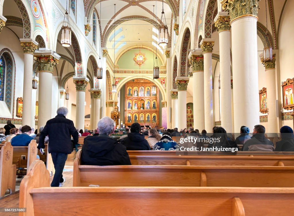 Santa Fe, NM: People in Pews in St Francis Cathedral