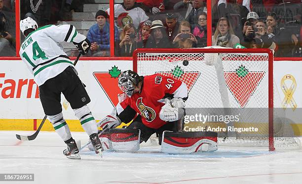 Jamie Benn the Dallas Stars scores the shoot-out winner against Robin Lehner of the Ottawa Senators at Canadian Tire Centre on November 3, 2013 in...