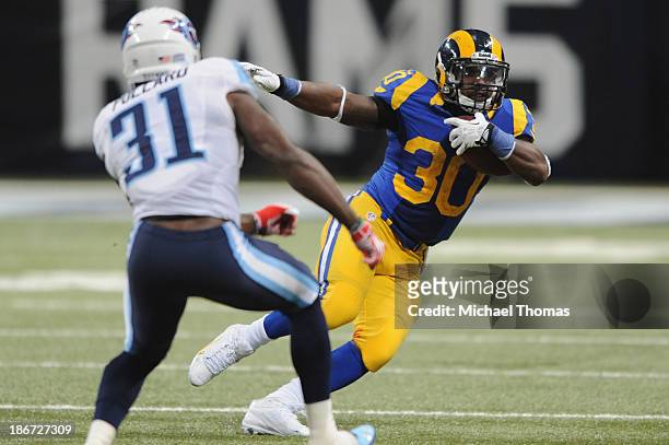 Zac Stacy of the St. Louis Rams runs against the Tennessee Titans in the fourth quarter at the Edward Jones Dome on November 3, 2013 in St. Louis,...