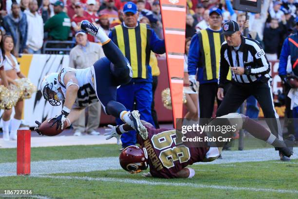 Running back Danny Woodhead of the San Diego Chargers is knocked out of bounds short of the goal line by David Amerson of the Washington Redskins...