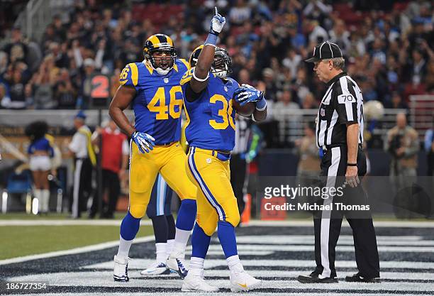 Zac Stacy of the St. Louis Rams scores a second quarter touchdown against the Tennessee Titans at the Edward Jones Dome on November 3, 2013 in St....