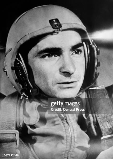 Soviet cosmonaut Valery Bykovsky wearing a helmet and flight suit, Soviet Union, 1963. Bykovsky flew on three space flights: Vostok 5, Soyuz 22, and...