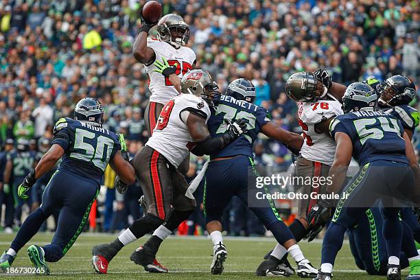 Running back Mike James of the Tampa Bay Buccaneers throws a touchdown pass to tight end Tom Crabtree in the second quarter against the Seattle...