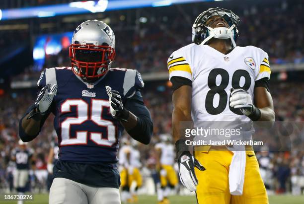 Emmanuel Sanders of the Pittsburgh Steelers reacts after missing an attempted catch in the endzone next to of Kyle Arrington of the New England...