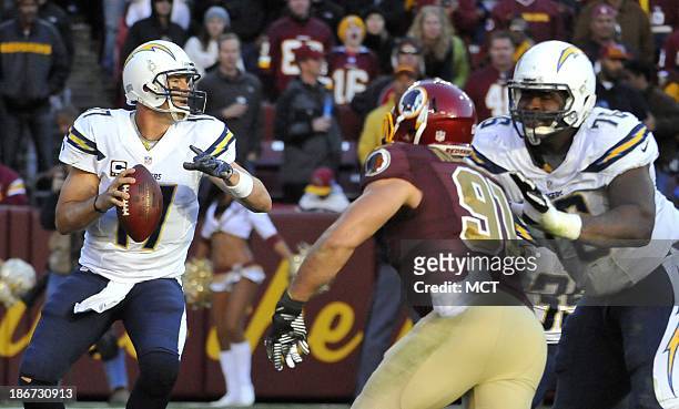 San Diego Chargers quarterback Philip Rivers looks for the open receiver during the fourth quarter against the Washington Redskins at FedEx Field in...