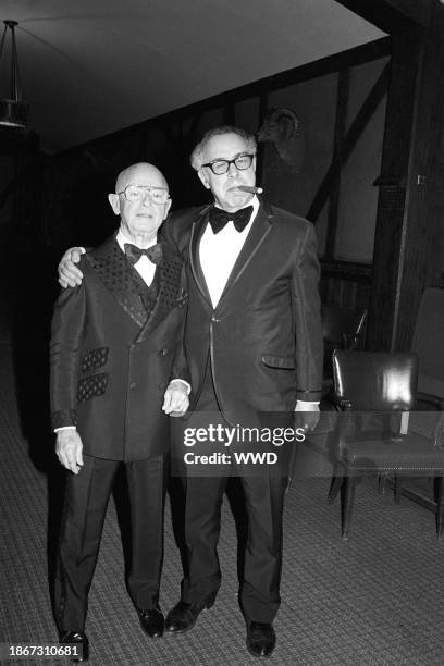 Agent Irving <Swifty> Lazar with columnist Art Buchwald at a party honoring late writer James Jones and his last novel, <Whistle.> Circa February 1978