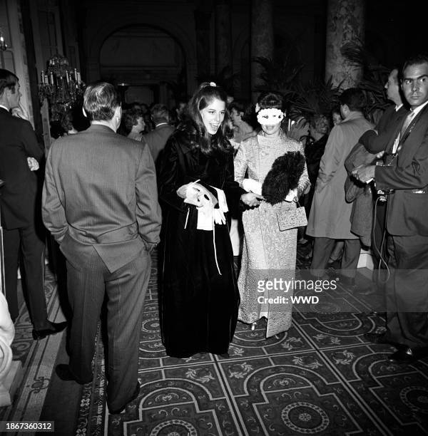 Two women arriving at Truman Capote's Black and White Ball in the Grand Ballroom at the Plaza Hotel in New York City