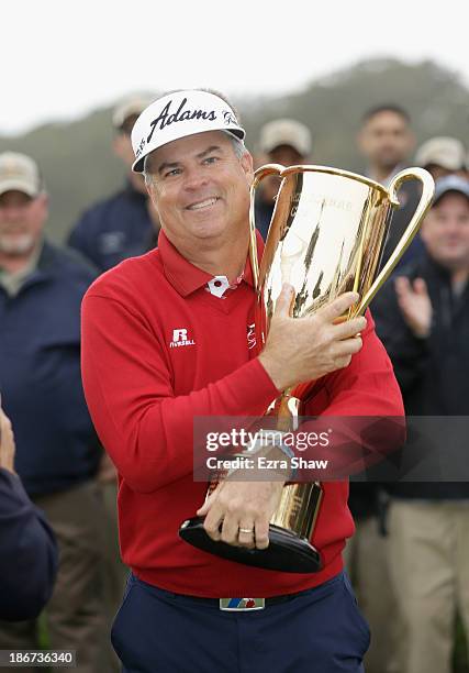 Kenny Perry holds his trophy for winning the overall points title for the Champions Tour following the Final Round of the Charles Schwab Cup...