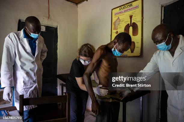 Drugs for Neglected Disease biologist Dr Sabine Specht works with her Congolese colleagues to examine people for symptoms of river blindness. She is...