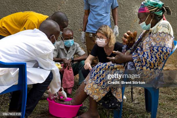 Drugs for Neglected Disease biologist Dr Sabine Specht works with her Congolese colleagues to examine people for symptoms of river blindness. She is...