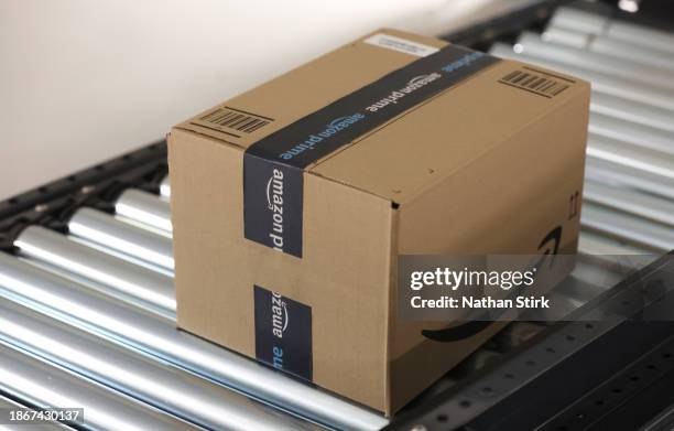 Amazon parcel is prepared for delivery at Amazon's Robotic Fulfillment Centre on December 19, 2023 in Sutton Coldfield, England. Launched in October,...