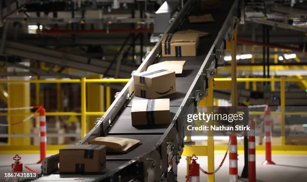 Amazon parcels are prepared for delivery at Amazon's Robotic Fulfillment Centre on December 19, 2023 in Sutton Coldfield, England. Launched in...