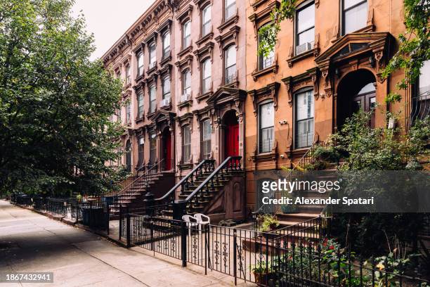 brownstone rowhouses in bedford - stuyvesant neighbourhood, brooklyn, new york city, usa - townhouse stock pictures, royalty-free photos & images