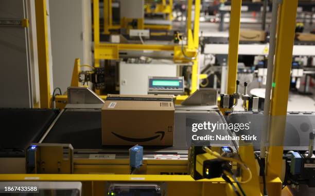 Amazon Boxes are prepared for delivery at Amazon's Robotic Fulfillment Centre on December 19, 2023 in Sutton Coldfield, England. Launched in October,...