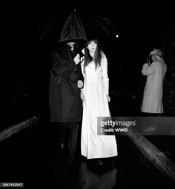 Model Penelope Tree arriving under an umbrella at Truman Capote's Black and White Ball