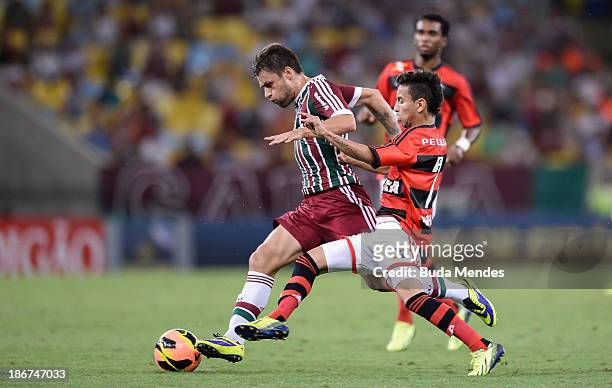 Rafinha of Flamengo struggles for the ball with a Rafael Sobis of Fluminense during a match between Flamengo and Fluminense as part of Brazilian...