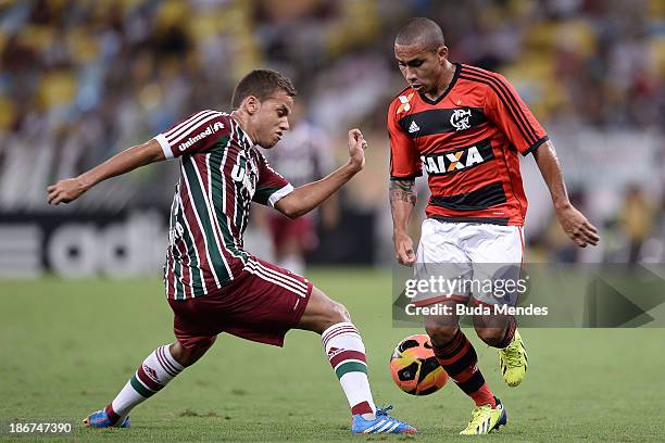 Bruninho of Flamengo struggles for the ball with a Rafinha of Fluminense during a match between Flamengo and Fluminense as part of Brazilian Serie A...