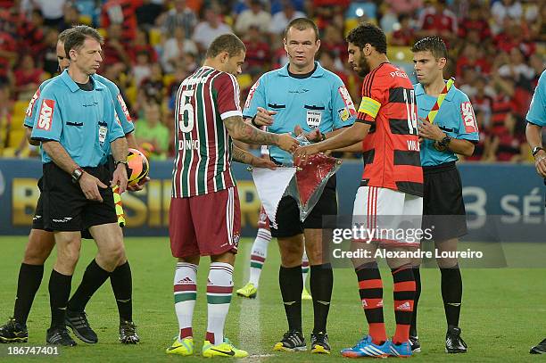 Edinho of Fluminense and Wallace of Flamengo exchange streamer of the teams before the match between Flamengo and Fluminense for the Brazilian Series...