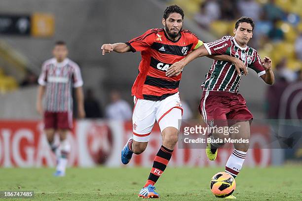 Wallace of Flamengo struggles for the ball with a Jean of Fluminense during a match between Flamengo and Fluminense as part of Brazilian Serie A 2013...