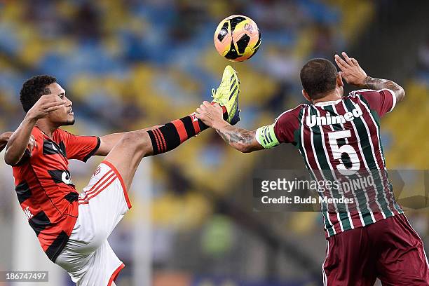 Hernane of Flamengo struggles for the ball with a Edinho of Fluminense during a match between Flamengo and Fluminense as part of Brazilian Serie A...