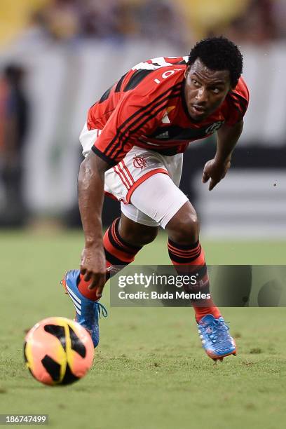 Amaral of Flamengo struggles for the ball during a match between Flamengo and Fluminense as part of Brazilian Serie A 2013 at Maracana Stadium on...