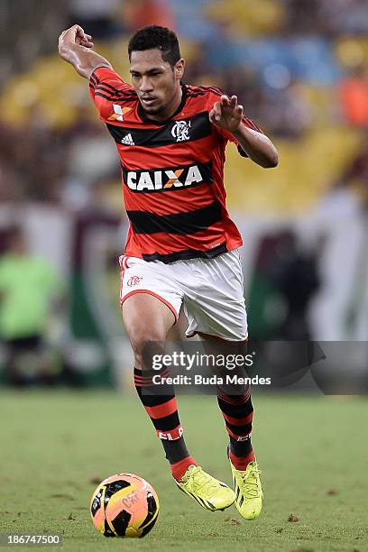 Hernane of Flamengo struggles for the ball during a match between Flamengo and Fluminense as part of Brazilian Serie A 2013 at Maracana Stadium on...