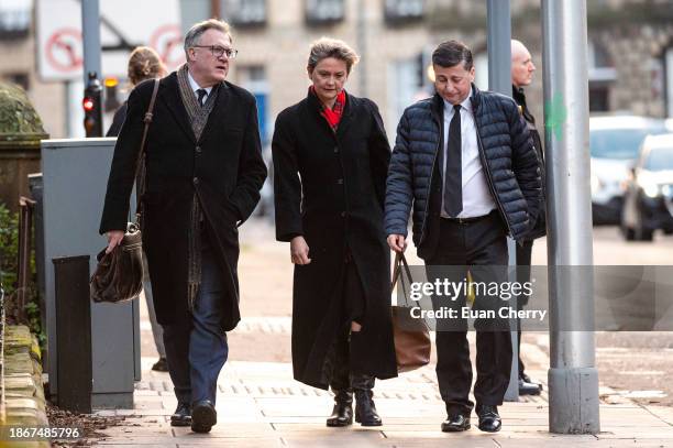 Former Labour politician Ed Balls and wife Shadow Home Secretary Yvette Cooper and Labour politician Douglas Alexander attend the memorial service...