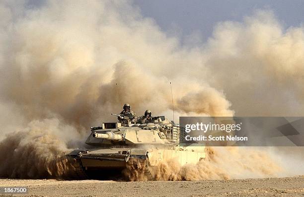 Army 3rd Infantry Division M1/A1 Abrahms tank rolls deeper into Iraqi territory March 23, 2003 south of the city of An Najaf, Iraq. U.S. And British...