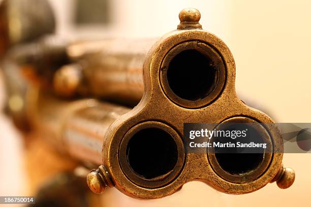 shooting a round - gun barrel stock pictures, royalty-free photos & images