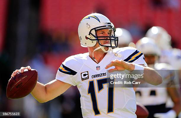 Quarterback Philip Rivers of the San Diego Chargers throws a pass while warming up before the start of the Chargers game against the Washington...