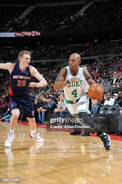 Keith Bogans of the Boston Celtics drives to the basket against Kyle Singler of the Detroit Pistons on November 3, 2013 at The Palace of Auburn Hills...