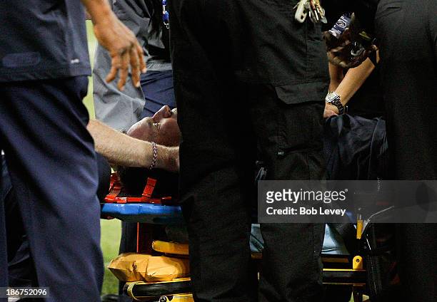 Houston Texans head coach Gary Kubiak is loaded on a stretcher after he collapsed on the field as the team left for halftime against the Indianapolis...