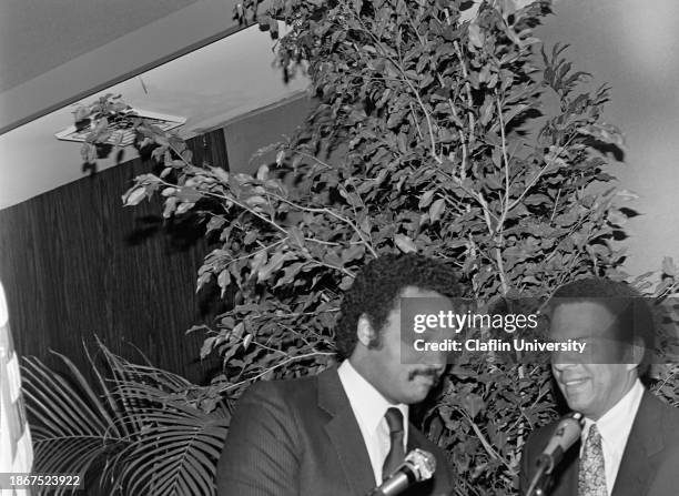 Rev. Jesse L. Jackson, Sr. At microphone with Andrew Jackson Young Jr during the National Conference of Black Mayors. Jesse Jackson is an American...