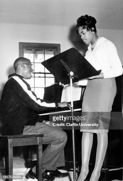 Claflin University student and professor during a musical rehearsal.