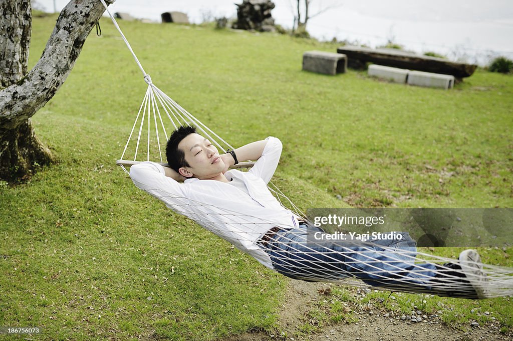 Man to relax in a hammock