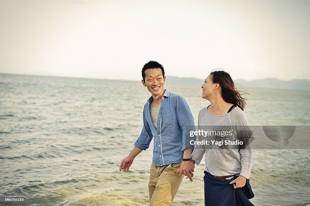 Couple walking on the beach