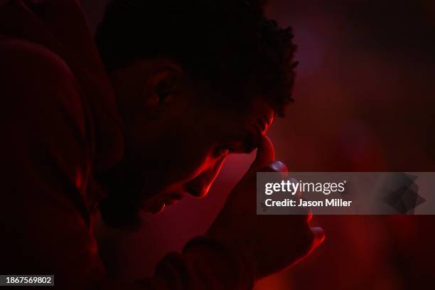 Donovan Mitchell of the Cleveland Cavaliers watches player introductions prior to the game against the Houston Rockets at Rocket Mortgage Fieldhouse...