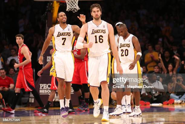 Pau Gasol of the Los Angeles Lakers celebrates along with Xavier Henry # after Gasol made two foul shots to put the Lakers ahead by two points with...