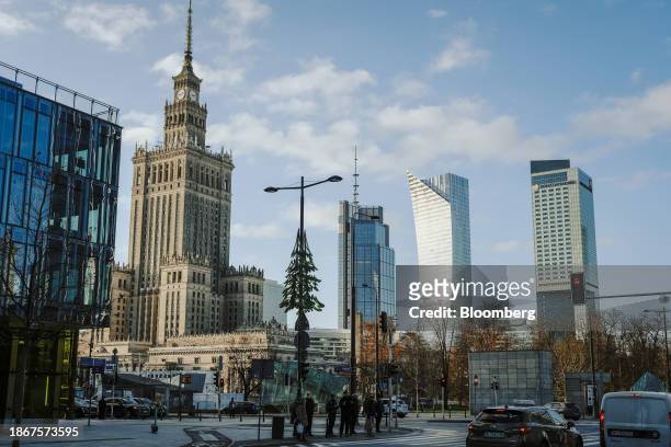 The Palace of Culture and Science, left, alongside skyscraper office buildings in downtown Warsaw, Poland, on Friday, Dec. 22, 2023. The central bank...
