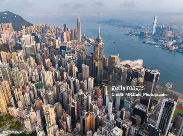 aerial view of hong kong city skyline - hong kong skyline drone stock pictures, royalty-free photos & images