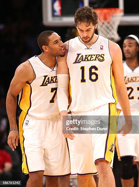 Pau Gasol of the Los Angeles Lakers is congratulated by Xavier Henry after Gasol made two foul shots to put the Lakers ahead by two points with six...