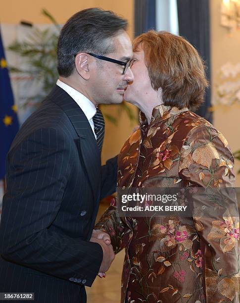 High Representative of the European Union for Foreign Affairs and Security Policy Catherine Ashton is welcomed by Indonesia's Foreign Minister Marty...