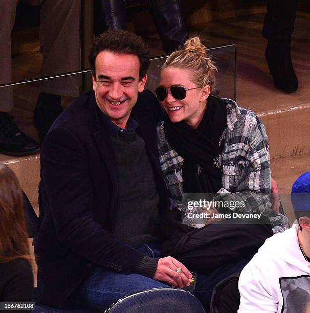 Olivier Sarkozy and Mary-Kate Olsen attend the Minnesota Timberwolves vs New York Knicks game at Madison Square Garden on November 3, 2013 in New...