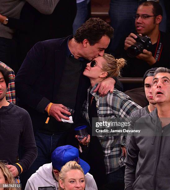 Olivier Sarkozy and Mary-Kate Olsen attend the Minnesota Timberwolves vs New York Knicks game at Madison Square Garden on November 3, 2013 in New...