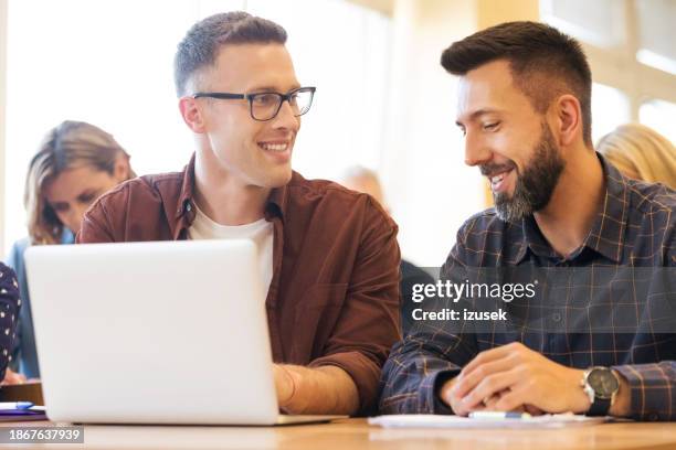 mid adult men during education training class - nontraditional student stock pictures, royalty-free photos & images