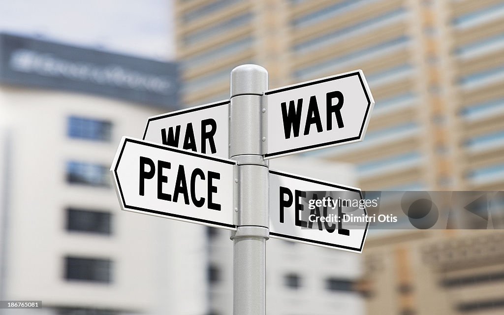 Street signs showing war and peace