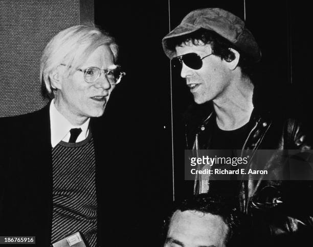 American pop artist Andy Warhol with singer-songwriter Lou Reed , circa 1980.