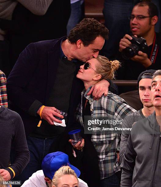 Olivier Sarkozy and Mary-Kate Olsen attend the Minnesota Timberwolves vs New York Knicks game at Madison Square Garden on November 3, 2013 in New...