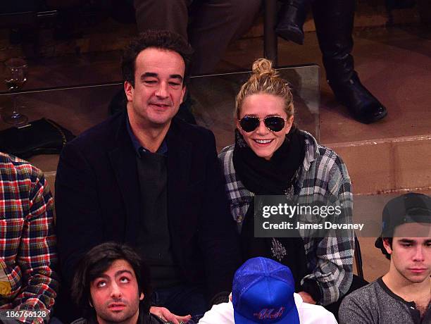 Olivier Sarkozy and Mary-Kate Olsen attend the Minnesota Timberwolves vs New York Knicks game at Madison Square Garden on November 3, 2013 in New...