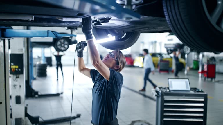 https://media.gettyimages.com/id/1867682680/video/female-mechanic-with-light-examining-car-chassis-in-auto-repair-shop.jpg?b=1&s=640x640&k=20&c=fHYp68HD_rHiNf3oh1dbLU9b6LPiCzUu32aqlqdcTG0=